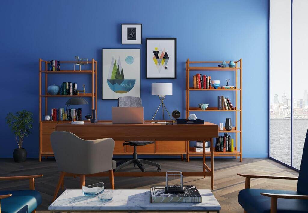 A living room with blue walls and furniture