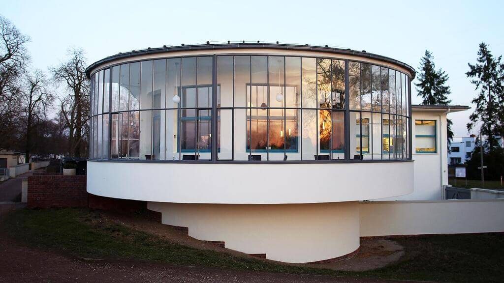 A circular Bauhaus Architecture with a glass window