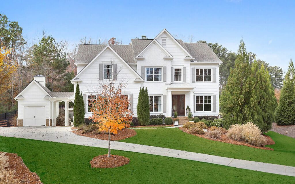 White Painted Brick House with Colorful Shutters