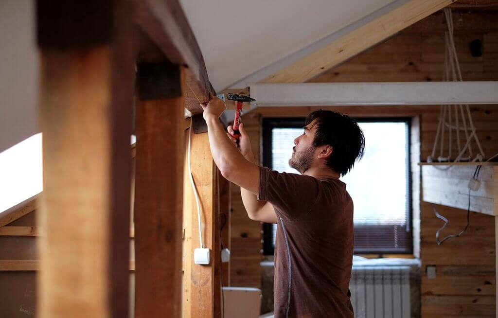 a men use hammer 