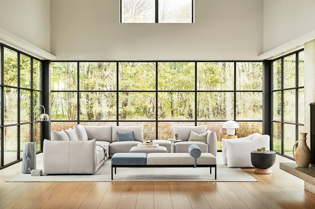 A living room with a large window and a couch
