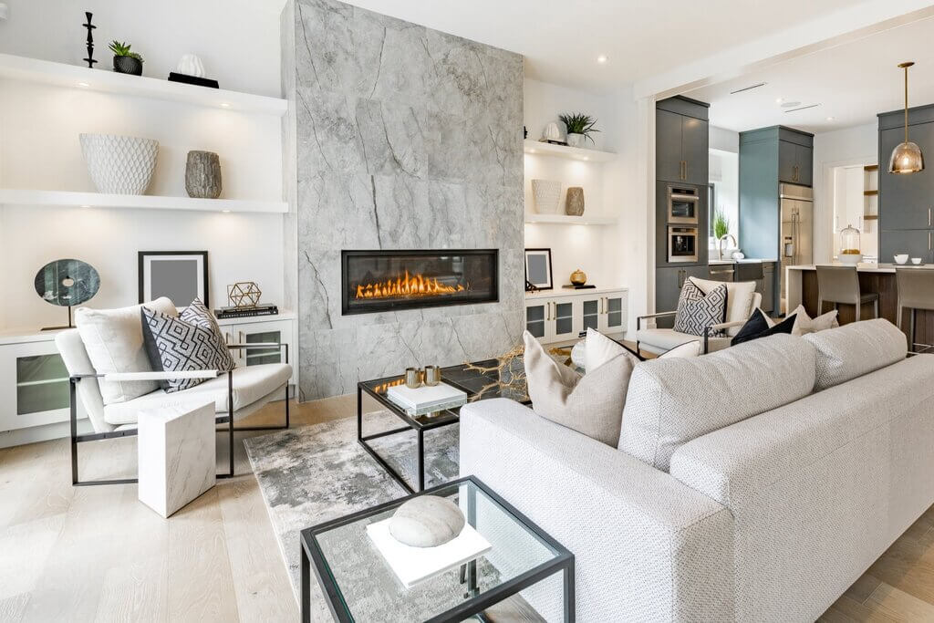A living room with furniture and a fire place
