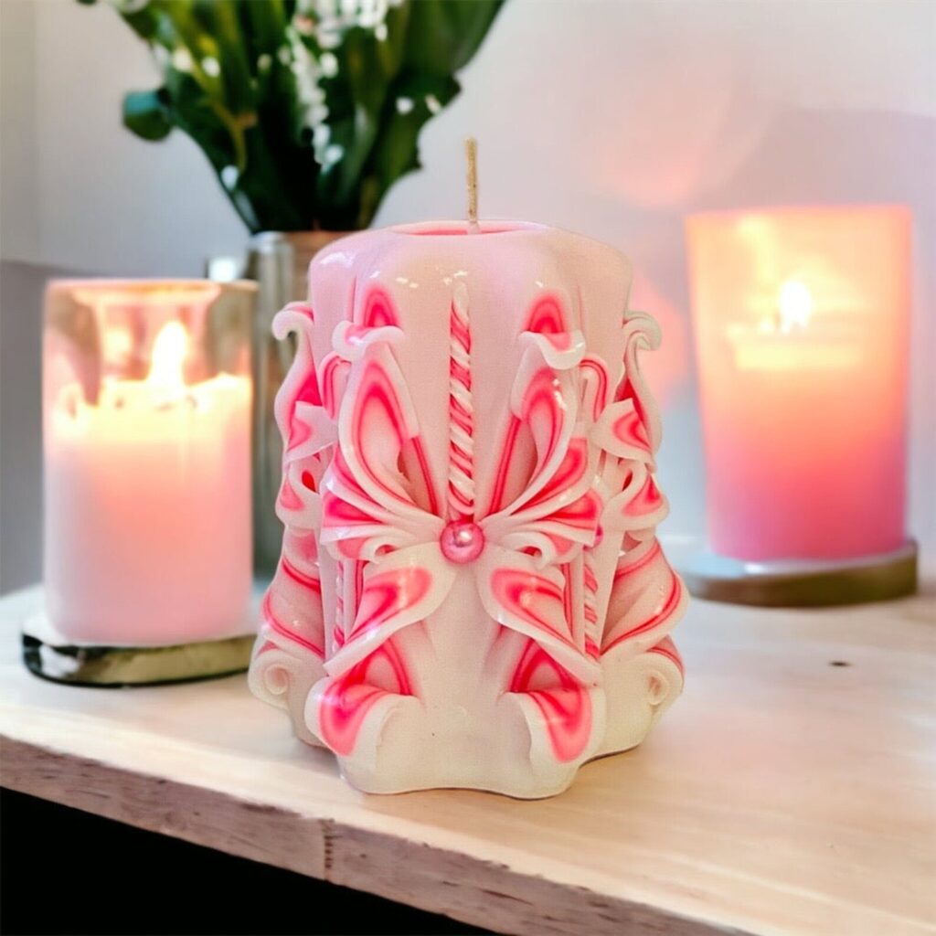 Table Centerpieces Featuring Pink Candles and Holly