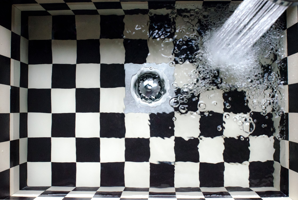Why does blocked drain occur