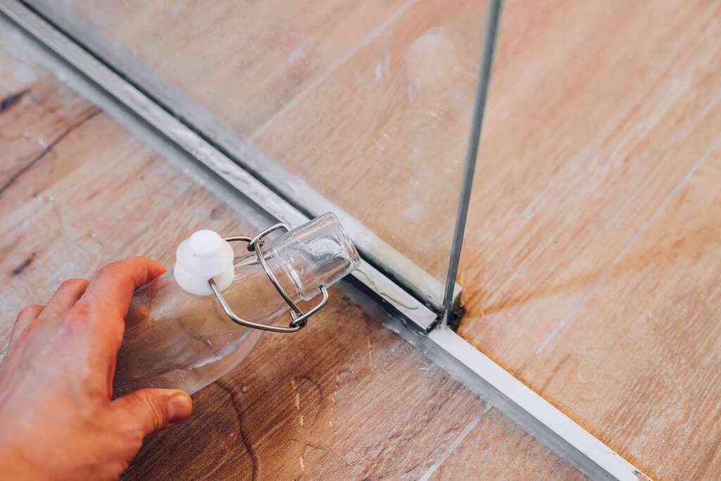 How to Clean Glass Shower Door Tracks With Vinegar