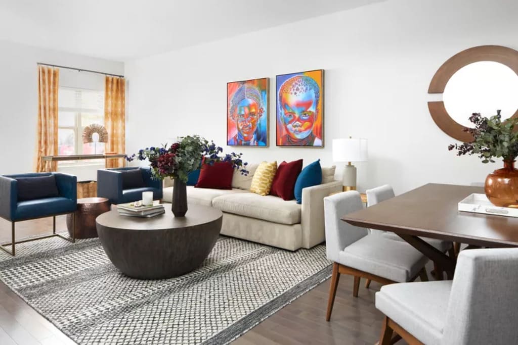 Living Room having Sofa Curtains and Dining Table