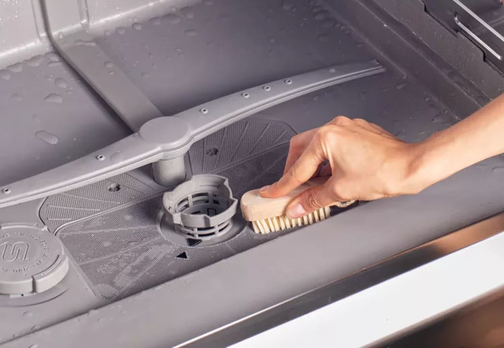 Scrubbing and Washing Interior Walls of Dishwasher